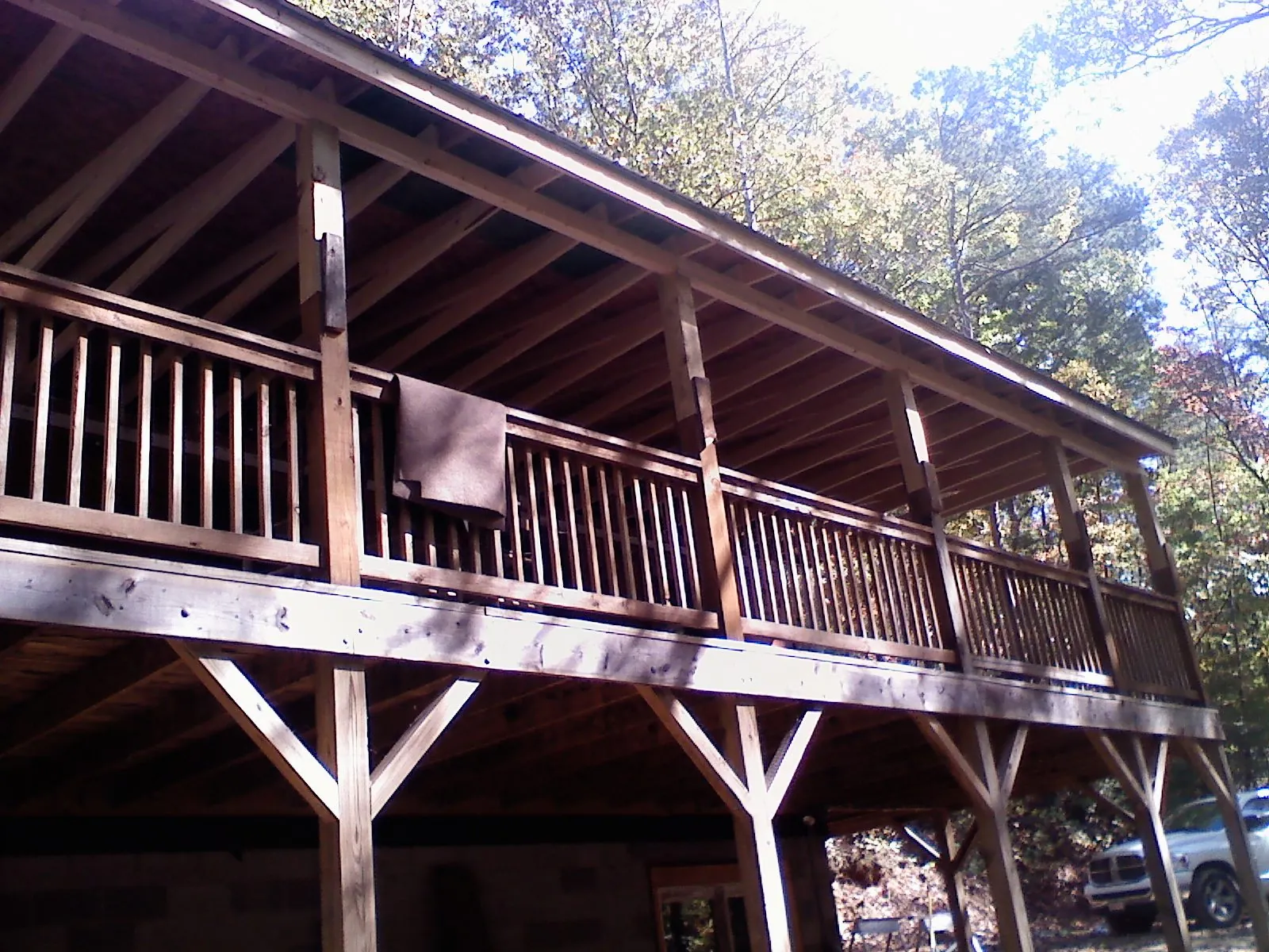 Timber framing under a new elevated porch and deck — Roof Leak Repair in Timnath by Roofing Brothers